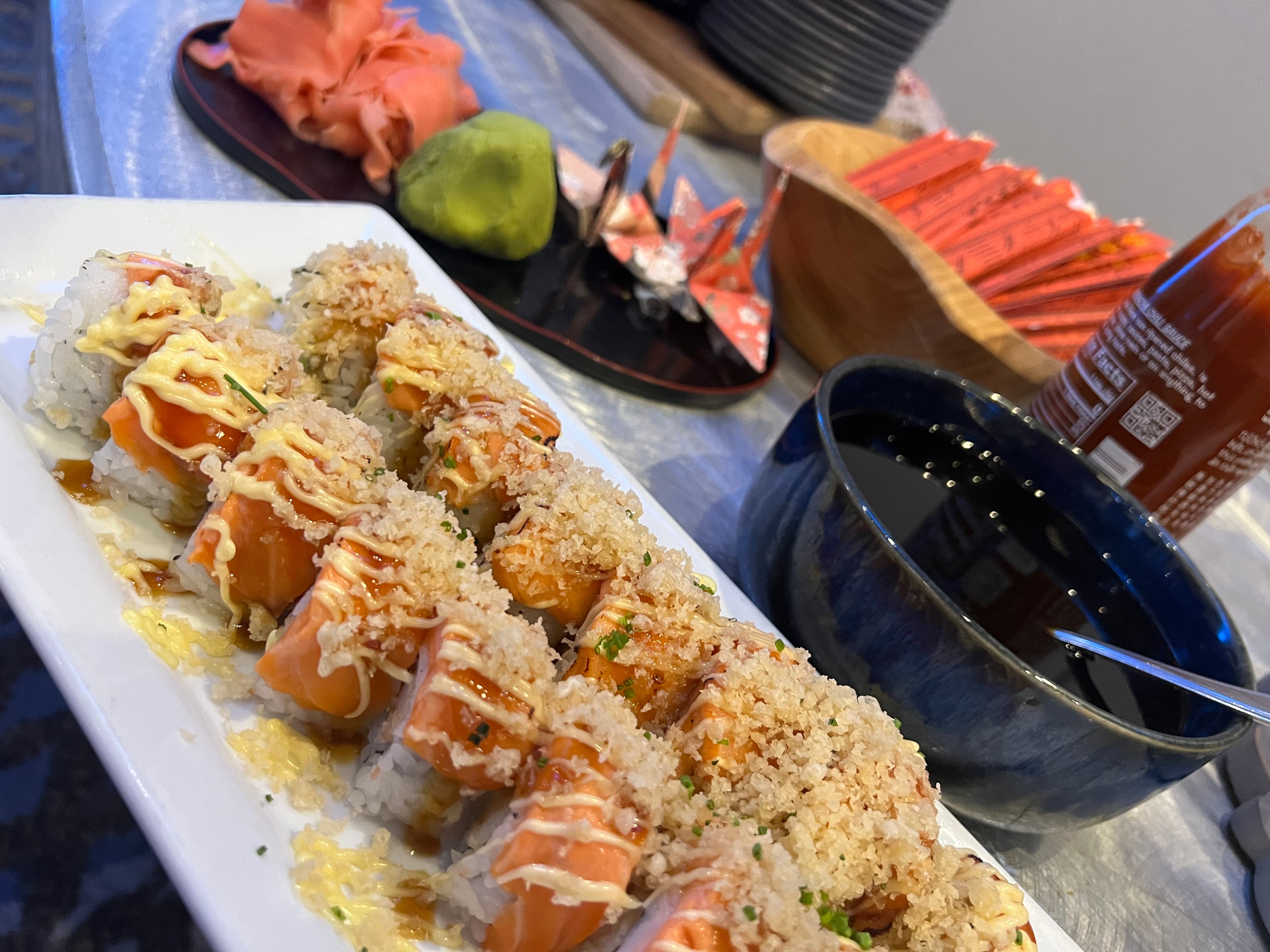 Luna Mesa Catering salmon sushi rolls with panko crust, spicy mayo drizzle, teriyaki glaze and chives